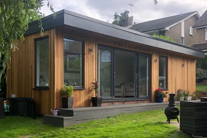Garden room exterior with dark cladding in Essex