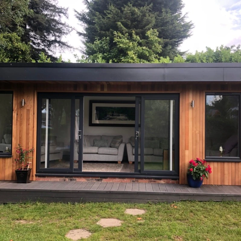 Garden room exterior with dark cladding in Essex