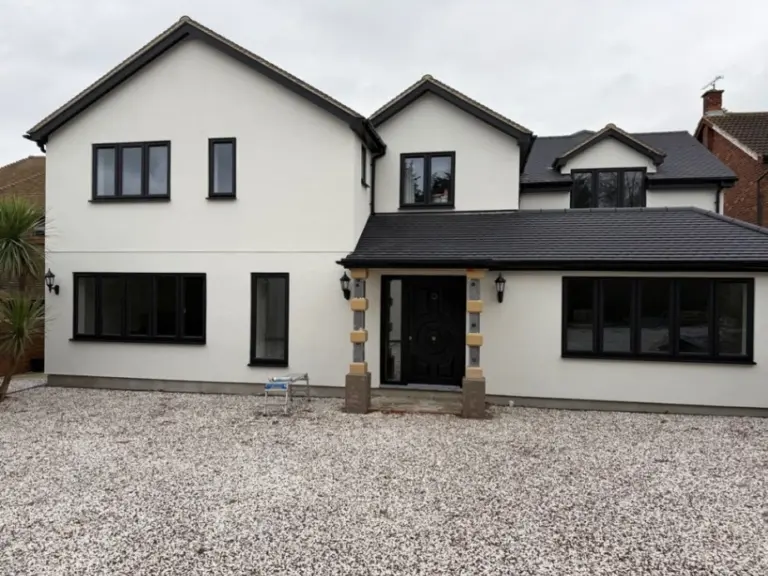 Rendered exterior finish after home renovation in Essex