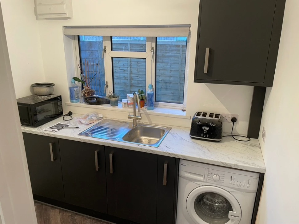 Kitchen sink and window area with fitted units in Essex